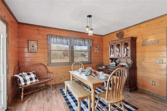 1525 Old Kyle Rd, Dorset, OH 44032 - dining space with light wood-style flooring and wooden walls