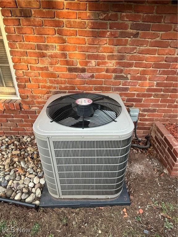 106 Wildwood Dr, Marietta, OH 45750 - exterior details featuring brick siding and central air condition unit