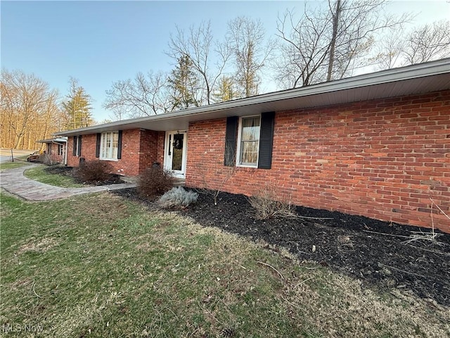 106 Wildwood Dr, Marietta, OH 45750 - view of side of property featuring brick siding and a lawn
