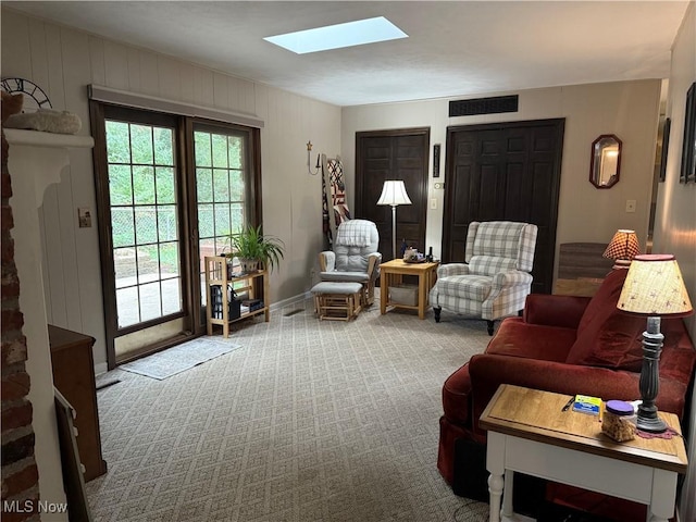 106 Wildwood Dr, Marietta, OH 45750 - living area featuring visible vents, carpet, and a skylight