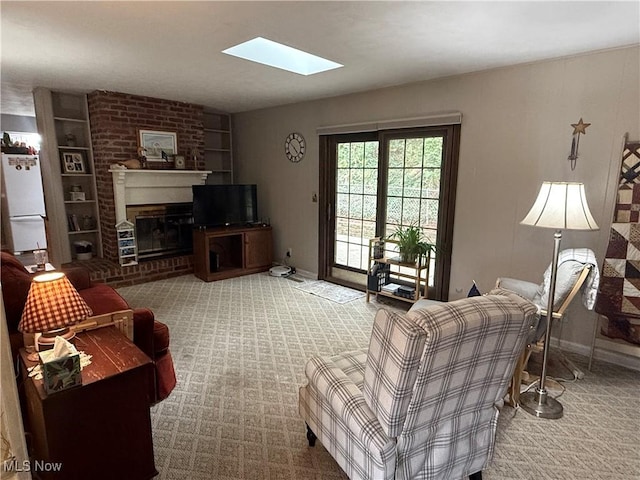 106 Wildwood Dr, Marietta, OH 45750 - living room featuring a brick fireplace, a skylight, carpet, and baseboards