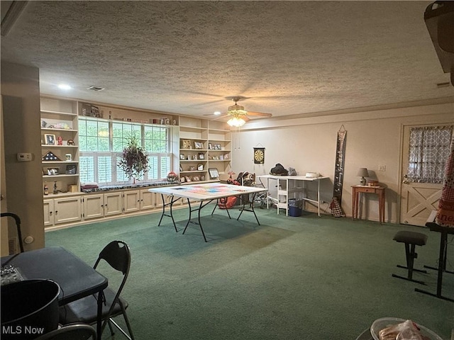 106 Wildwood Dr, Marietta, OH 45750 - playroom featuring a textured ceiling, a ceiling fan, and carpet floors