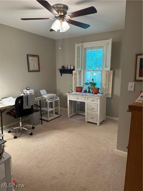 106 Wildwood Dr, Marietta, OH 45750 - home office with ceiling fan, baseboards, and light carpet