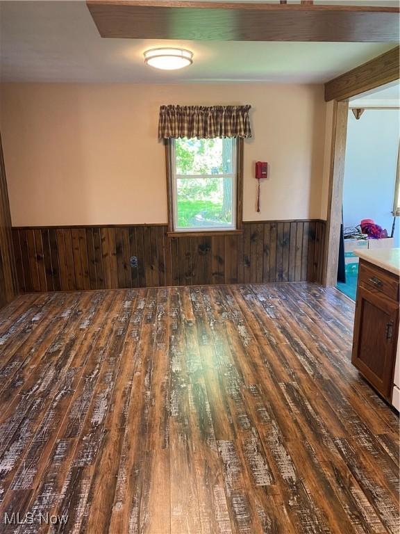 30173 Georgetown Rd, Salem, OH 44460 - empty room with hardwood / wood-style flooring, a wainscoted wall, and wooden walls