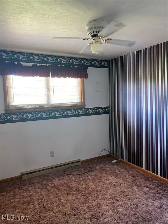 30173 Georgetown Rd, Salem, OH 44460 - spare room with a baseboard radiator, carpet floors, a ceiling fan, and baseboards