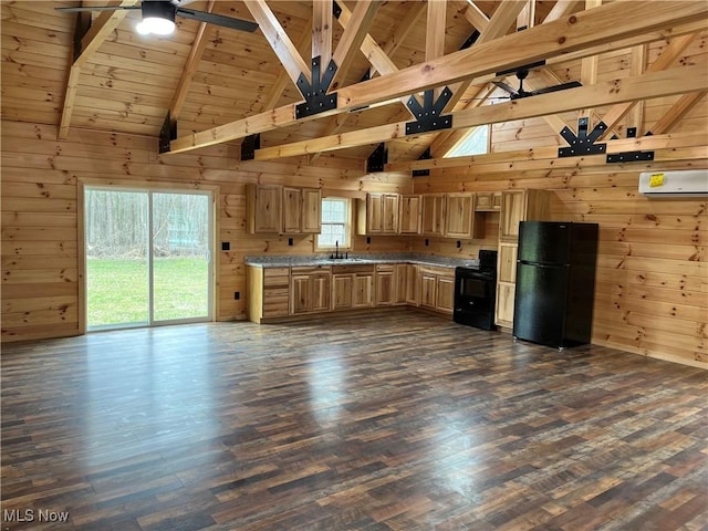 2239 Eureka Rd, Ashtabula, OH 44004 - kitchen with wooden walls, a ceiling fan, black appliances, and beam ceiling