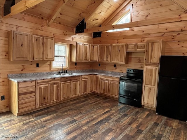 2239 Eureka Rd, Ashtabula, OH 44004 - kitchen featuring vaulted ceiling with beams, a sink, black appliances, and wood walls