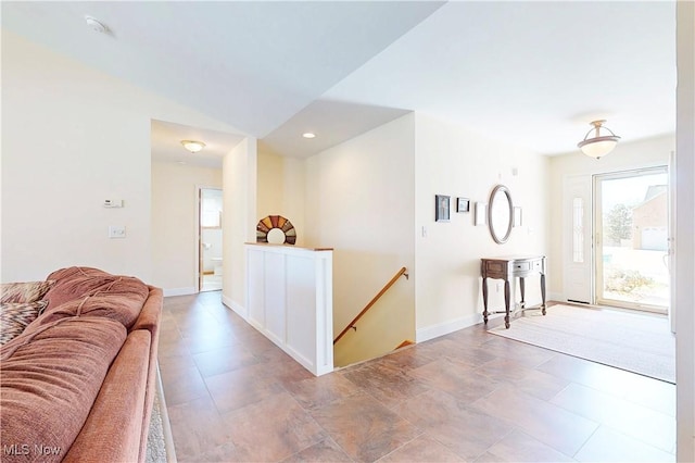 living room with recessed lighting, baseboards, and lofted ceiling