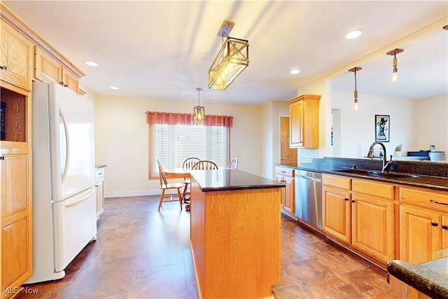kitchen with a sink, a center island, freestanding refrigerator, recessed lighting, and dishwasher