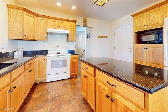 kitchen featuring black microwave, under cabinet range hood, recessed lighting, dark stone countertops, and electric range