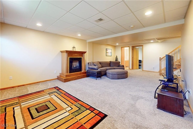 living room with visible vents, a glass covered fireplace, recessed lighting, carpet, and baseboards