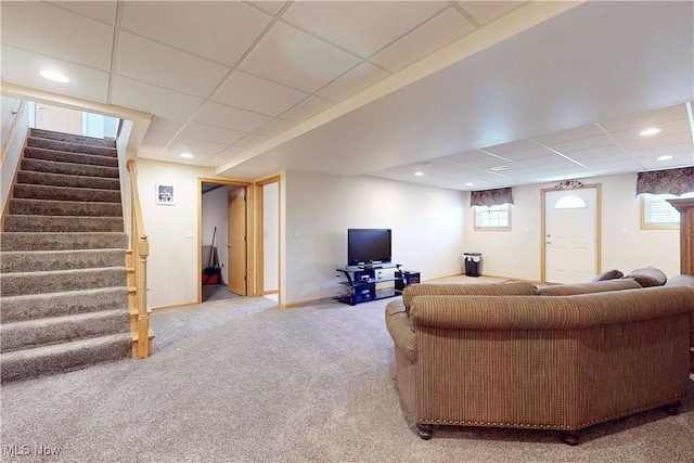 living room featuring baseboards, carpet floors, recessed lighting, a drop ceiling, and stairs