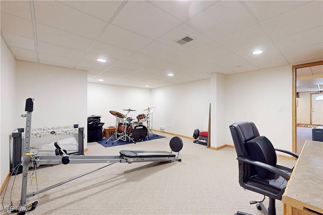 exercise area with recessed lighting, visible vents, baseboards, and a drop ceiling