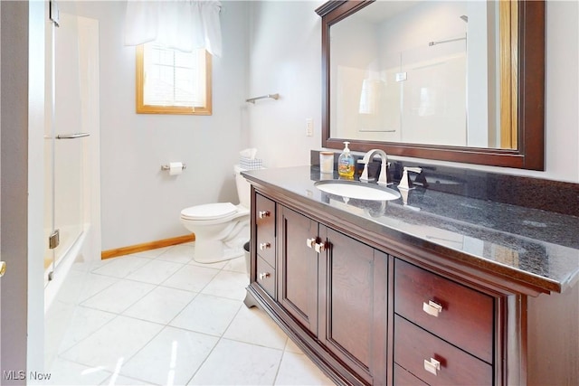 full bathroom featuring tile patterned floors, toilet, vanity, and baseboards