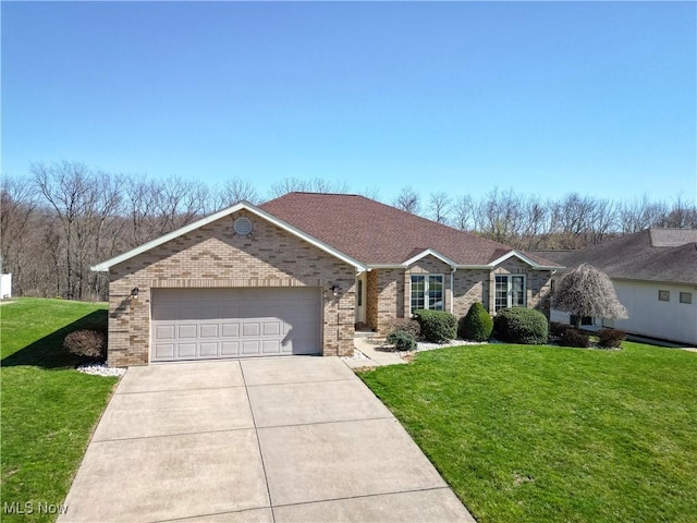 single story home with a garage, driveway, brick siding, and a front lawn