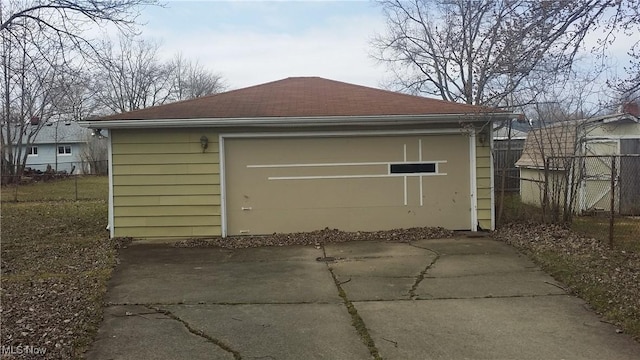 garage with fence