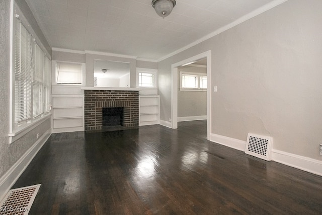 unfurnished living room with dark wood finished floors, a brick fireplace, baseboards, and visible vents