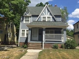 1033 Rushleigh Rd, Cleveland Heights, OH 44121 - view of front of home featuring covered porch and a front yard