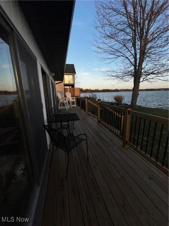 2326 Canfield Rd, Akron, OH 44312 - deck at dusk featuring a water view