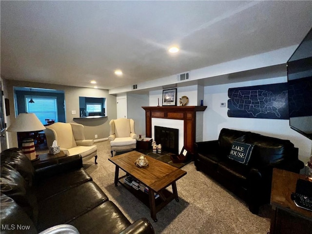 2326 Canfield Rd, Akron, OH 44312 - living room with recessed lighting, visible vents, carpet flooring, and a glass covered fireplace
