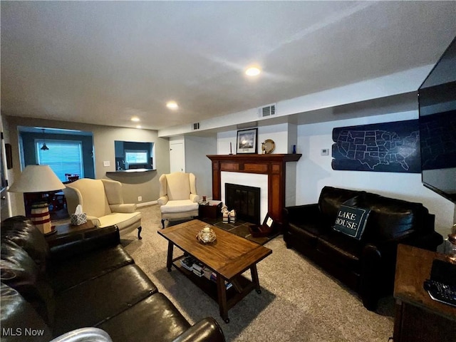 2326 Canfield Rd, Akron, OH 44312 - living area with a glass covered fireplace, carpet flooring, recessed lighting, and visible vents