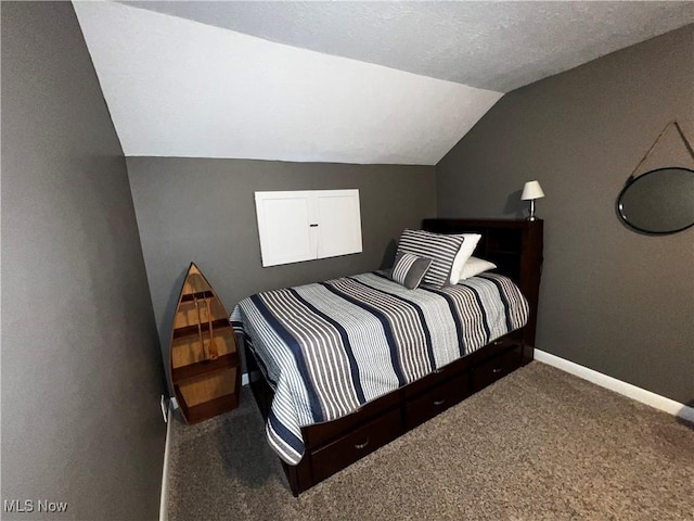 2326 Canfield Rd, Akron, OH 44312 - bedroom featuring baseboards, a textured ceiling, carpet floors, and vaulted ceiling