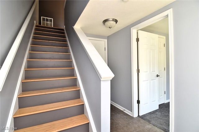 1261 W 74, Cleveland, OH 44102 - staircase with tile patterned flooring and baseboards