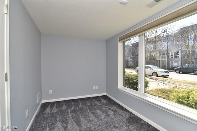 1261 W 74, Cleveland, OH 44102 - spare room featuring dark carpet and baseboards