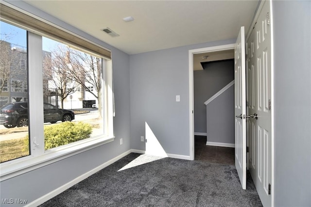 1261 W 74, Cleveland, OH 44102 - empty room with carpet floors, healthy amount of natural light, and baseboards