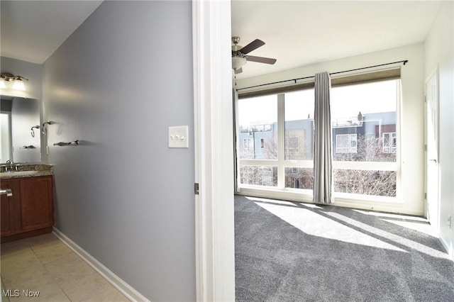 1261 W 74, Cleveland, OH 44102 - interior space featuring a ceiling fan, baseboards, and vanity