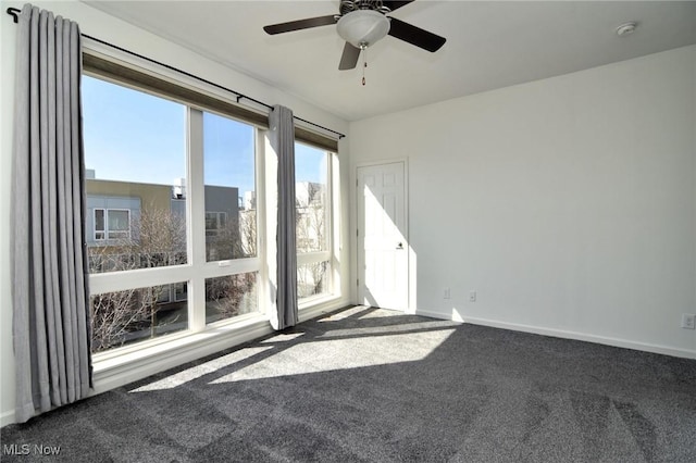 1261 W 74, Cleveland, OH 44102 - unfurnished room with dark colored carpet, a smoke detector, a ceiling fan, and baseboards