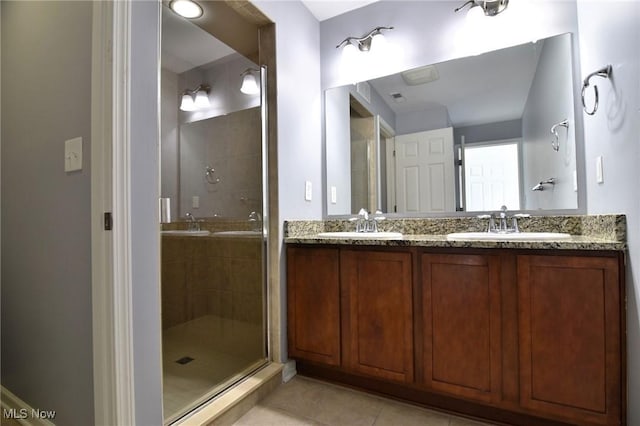1261 W 74, Cleveland, OH 44102 - bathroom with a shower stall, tile patterned floors, and double vanity
