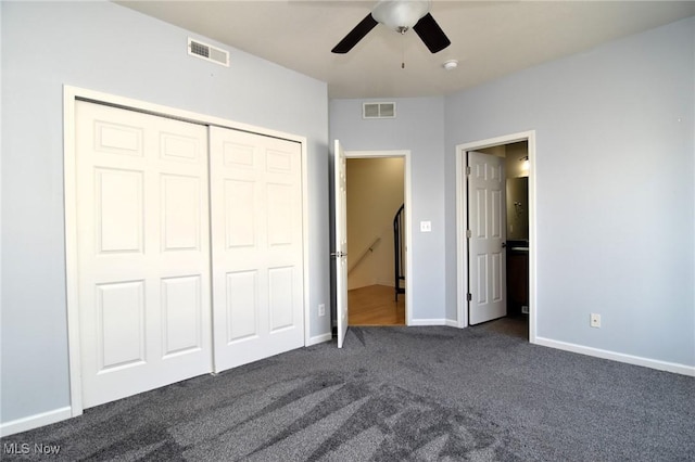 1261 W 74, Cleveland, OH 44102 - unfurnished bedroom with dark carpet, baseboards, a closet, and ceiling fan