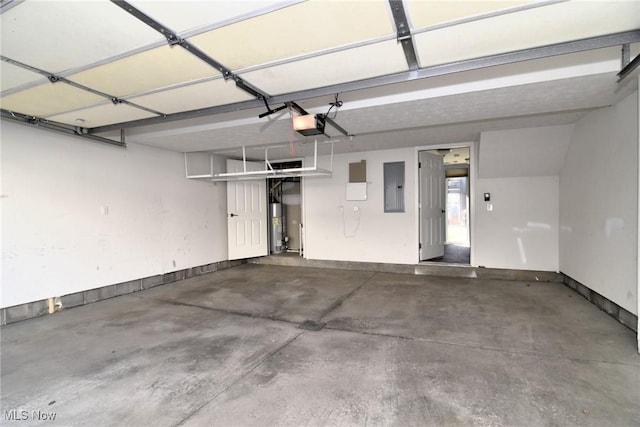 1261 W 74, Cleveland, OH 44102 - garage featuring electric panel, water heater, and a garage door opener