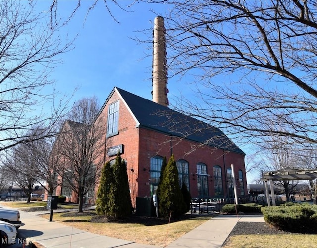 1261 W 74, Cleveland, OH 44102 - view of side of home with a chimney and brick siding