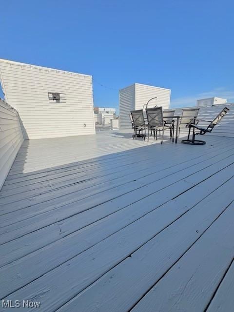 1261 W 74, Cleveland, OH 44102 - wooden terrace with outdoor dining area