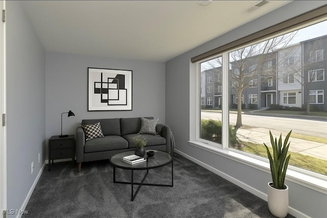1261 W 74, Cleveland, OH 44102 - living area featuring dark carpet and baseboards