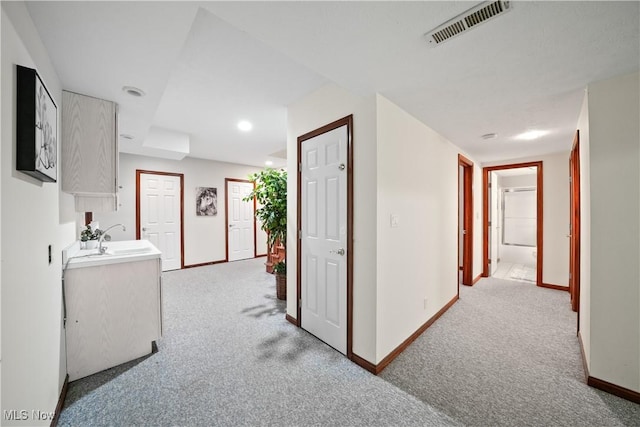 4100 Chagrin River Rd, Moreland Hills, OH 44022 - hall featuring light carpet, baseboards, a sink, and recessed lighting