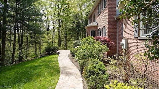 4100 Chagrin River Rd, Moreland Hills, OH 44022 - view of side of property featuring brick siding and a yard