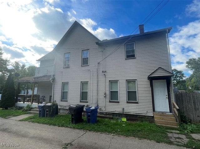 3782 W 38th St, Cleveland, OH 44109 - back of house featuring entry steps, a chimney, and covered porch