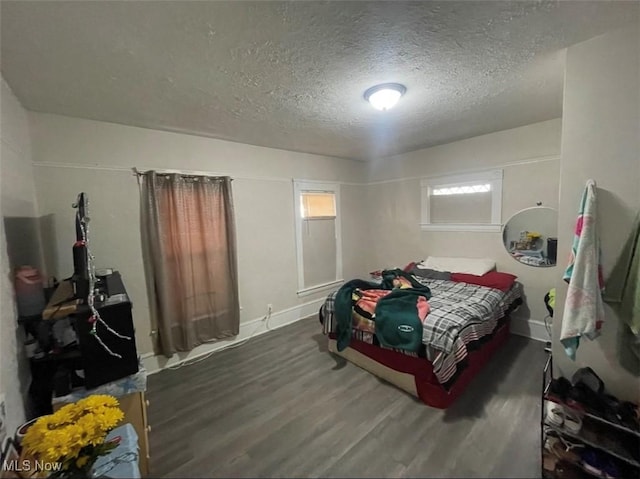 3782 W 38th St, Cleveland, OH 44109 - bedroom with wood finished floors, a textured ceiling, and baseboards