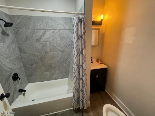3782 W 38th St, Cleveland, OH 44109 - bathroom featuring shower / tub combo with curtain, wood finished floors, toilet, vanity, and baseboards