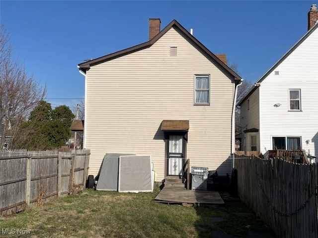 3782 W 38th St, Cleveland, OH 44109 - back of property featuring a chimney and entry steps