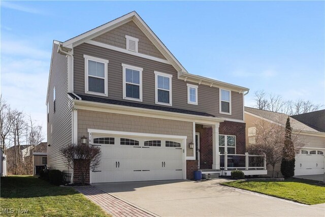 3186 Blackburn Ln, Brunswick, OH 44212 - traditional home featuring concrete driveway, a front lawn, and a garage
