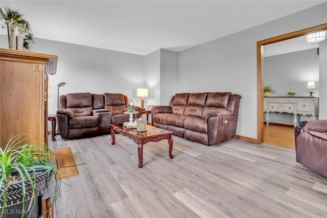9620 Bimeler St NE, Bolivar, OH 44612 - living area featuring baseboards and light wood-style flooring