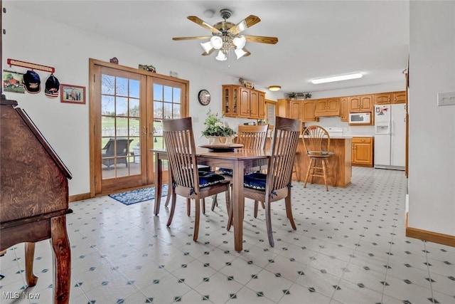 9620 Bimeler St NE, Bolivar, OH 44612 - dining area featuring french doors, baseboards, light floors, and ceiling fan