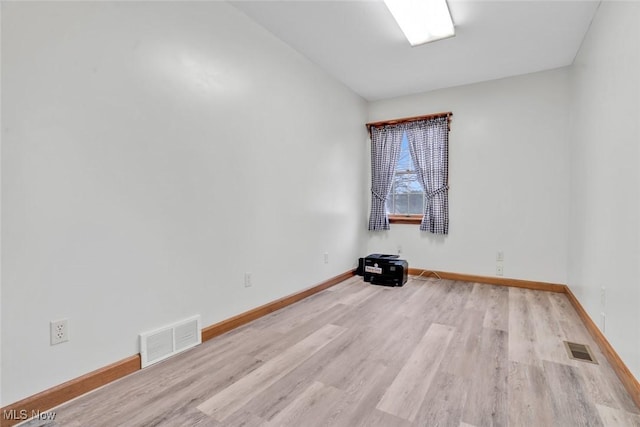 9620 Bimeler St NE, Bolivar, OH 44612 - unfurnished room with visible vents, baseboards, and wood finished floors
