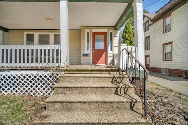 doorway to property with a porch