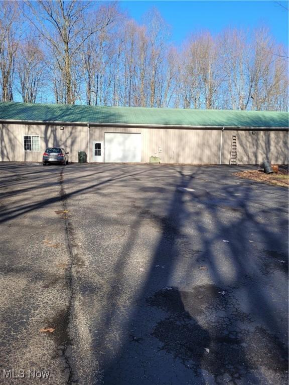 7544 State Rd, Wadsworth, OH 44281 - exterior space with aphalt driveway and a garage