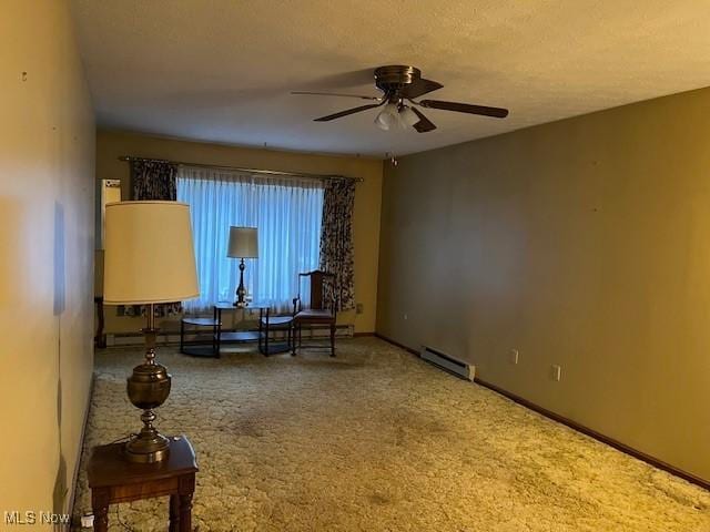 unfurnished room with a textured ceiling, carpet, a baseboard radiator, baseboards, and ceiling fan